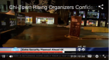 Outdoor event signage banners and a freestanding yard sign displayed in Chicago Downtown at night.