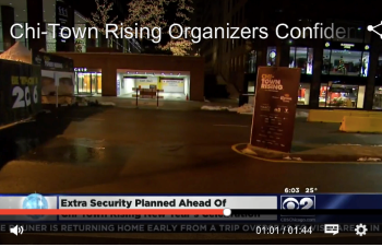 Outdoor event signage banners and a freestanding yard sign displayed in Chicago Downtown at night.