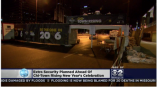 Outdoor fabric event banners mounted on metal barricades at night in Chicago Downtown.