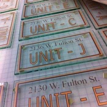 Custom glass signs made to look like license plates