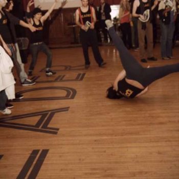People dancing on a floor with the Reader logo