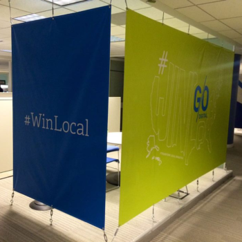 Hanging banners with the hashtag #winlocal
