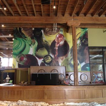 Alcohol wall mural behind bar