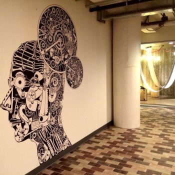 Custom wall graphic of head made out of cogs