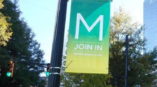 Custom sign attached to lamp post