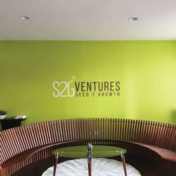 S2G Ventures logo decal on green wall