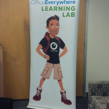 Learning Lab retractable banner with cartoon guy wearing a backpack