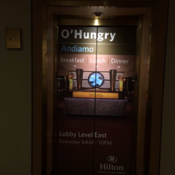 O'Hungry Andiamo advertisement for Hilton at the O'Hare airport on an elevator wrap