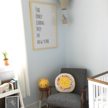 The Only Living Boy In New York poster in the corner of a bedroom