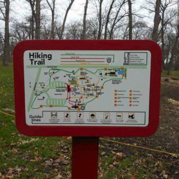 Directional sign providing map of hiking trails