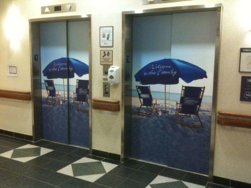 Elevator wraps of beach setting that welcomes guests