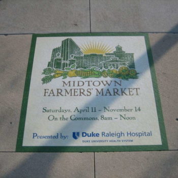 Outdoor floor graphic promoting Midtown Farmers' Market