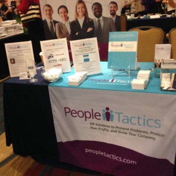 Table covering/topper promoting People Tactics HR solutions