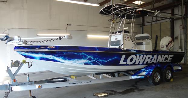 A boat with a vehicle wrap promoting Lowrance