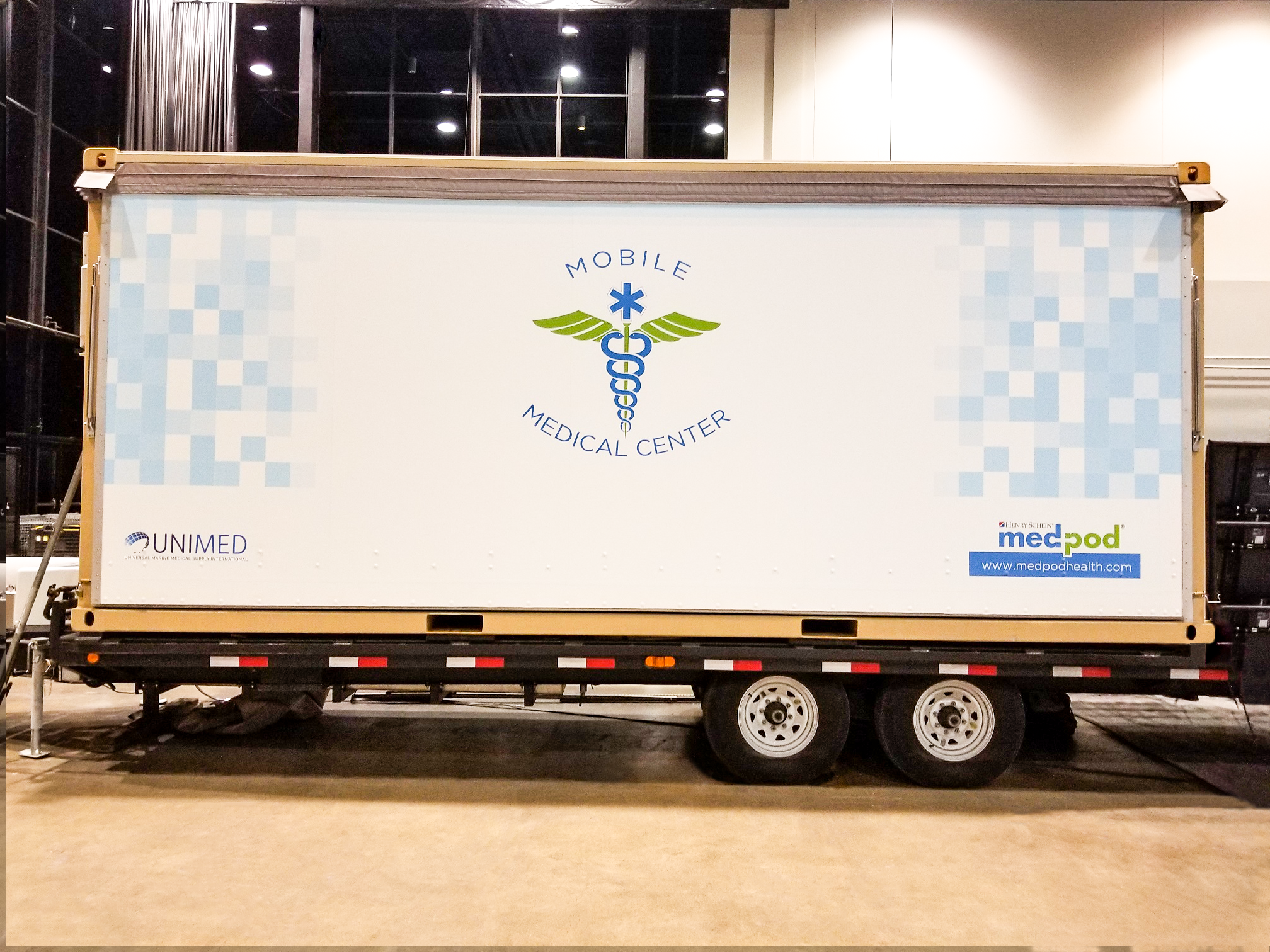 Vehicle wrap on trailer promoting Medpod's mobile medical center