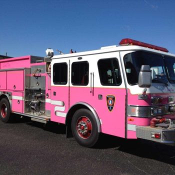 A pink vehicle wrap on a fire truck