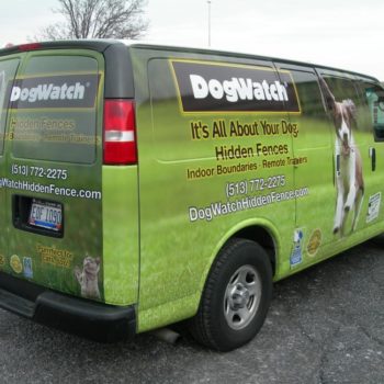 A side view of a  green vehicle wrap for Dog Watch 