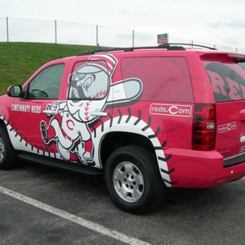 A red vehicle wrap for the Cincinnati Reds