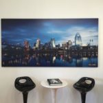 A large wall mural of a city skyline