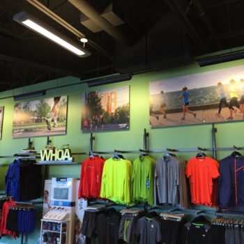 Multiple retail graphics at an athletic apparel store