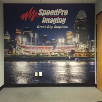 A wall mural for SpeedPro Imaging of a city skyline