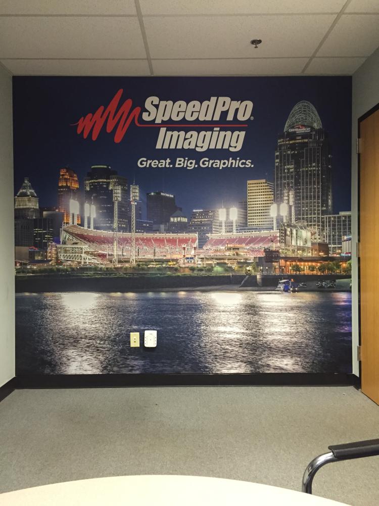 A wall mural for SpeedPro Imaging of a city skyline