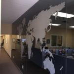 A window graphic of a worldmap in an office