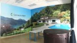 A large wall mural of a house and a pool 