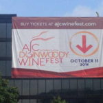 A custom banner on a building advertising an event