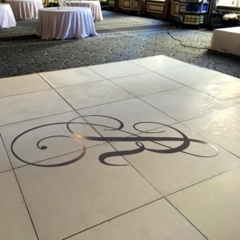 A floor graphic of lettering at an event