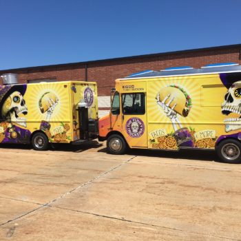 Wholly Frijoles trucks displaying graphic wraps