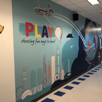 Wall mural in a school promoting play 