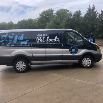 Side view of van with pet food decals