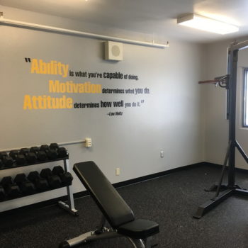 gym wall with an inspirational quote