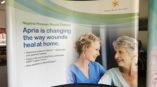 Apria Healthcare banner featuring nurse and patient