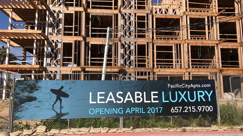 leasing banner on a fence