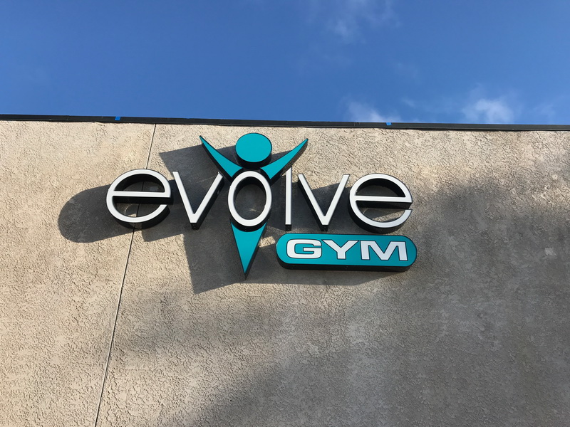 Evolve Gym name and logo on side of building