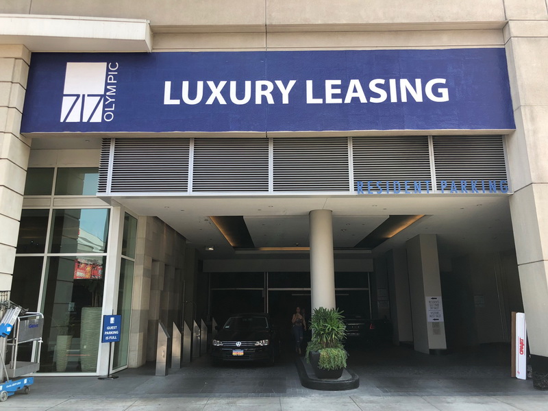 luxury leasing sign outside a building