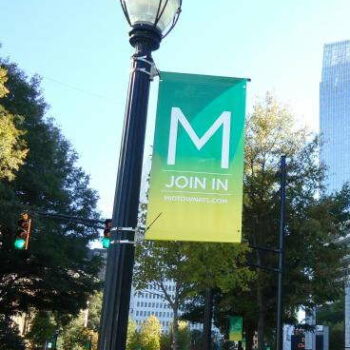 Banner hanging from a lamp post 