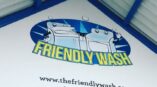 Friendly Wash wall graphic