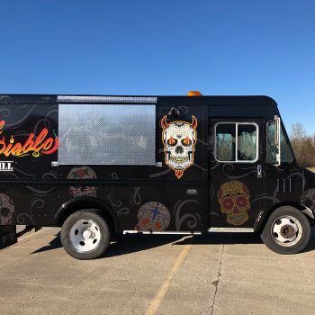 Van with horror-themed custom vehicle wrap
