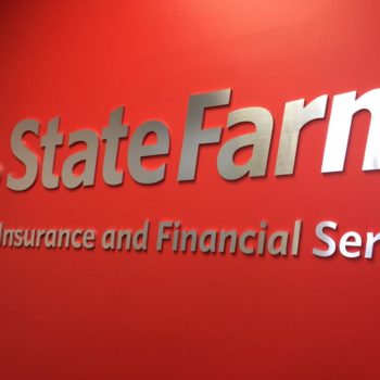 State Farm metal logo hanging on wall