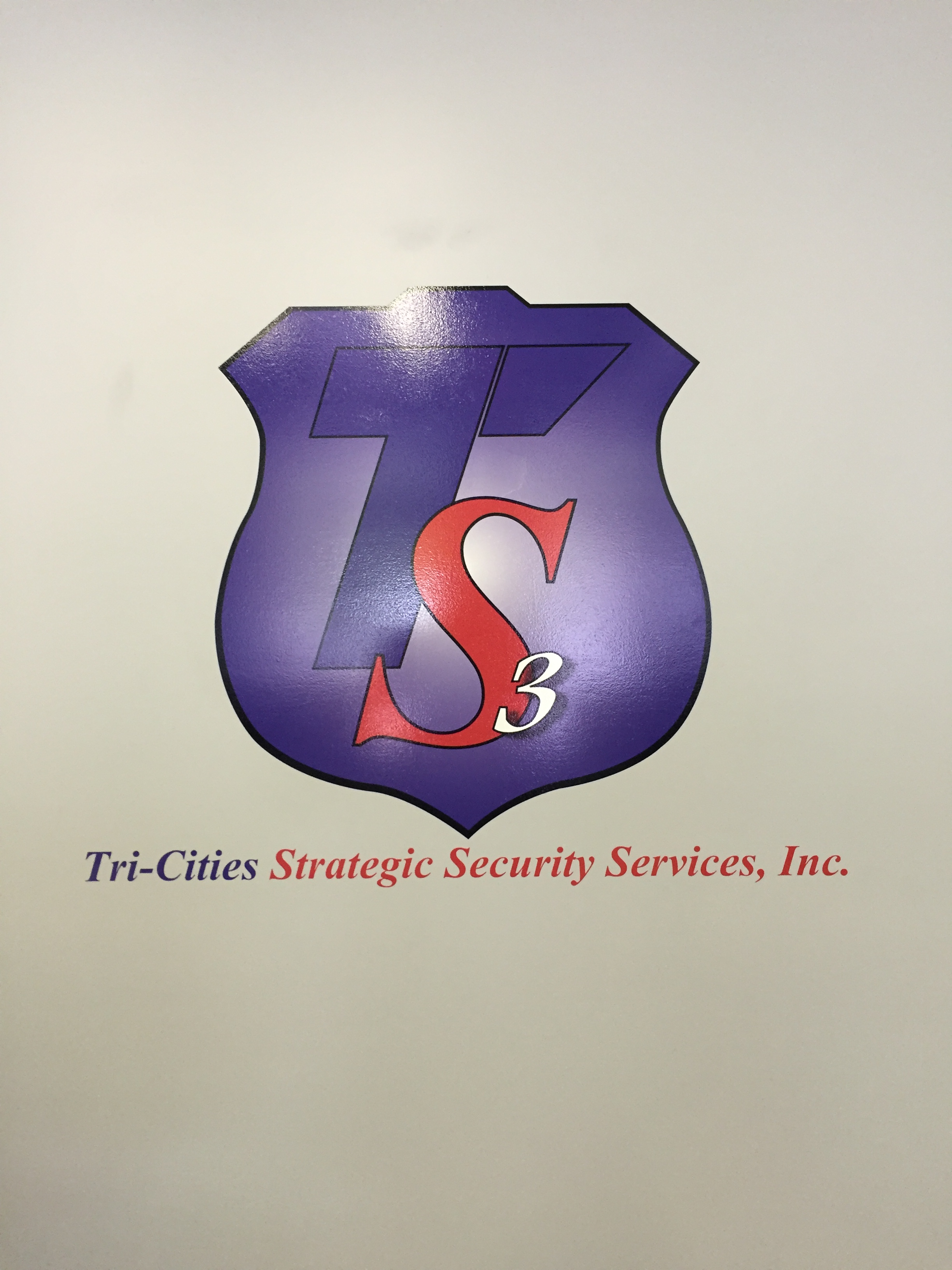 Tri-Cities Strategic Security Services logo graphic on wall