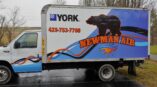 vehicle wrap with graphics on a delivery truck