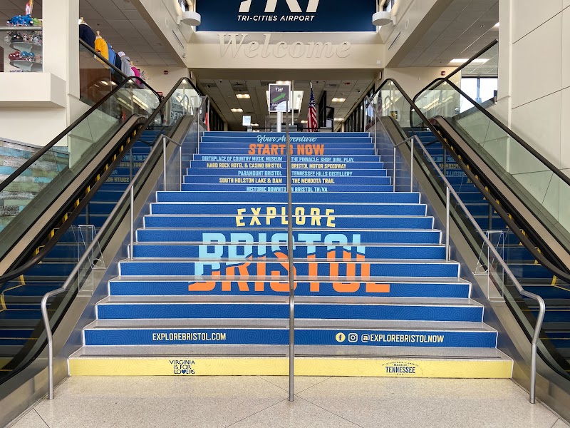 Blue vinyl floor graphics on stairs with text and logos in Tri-Cities - Bristol, Johnson City &