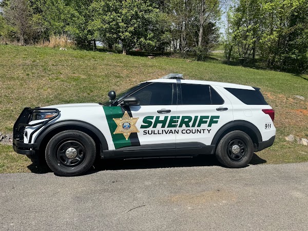Partial fleet wrap with sheriff badge and text on white SUV in Tri-Cities - Bristol, Johnson City &