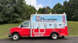 Partial fleet wrap with plumbing electrical HVAC graphics on a red truck in Tri-Cities - Bristol,