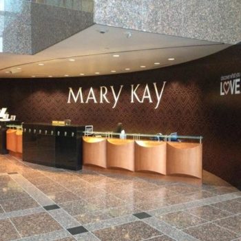 Mary Kay indoor wall signage behind desk