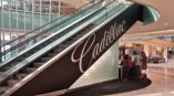 Cadillac mural on side of an escalator