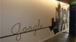 Google Dallas wall mural with three people in black and white